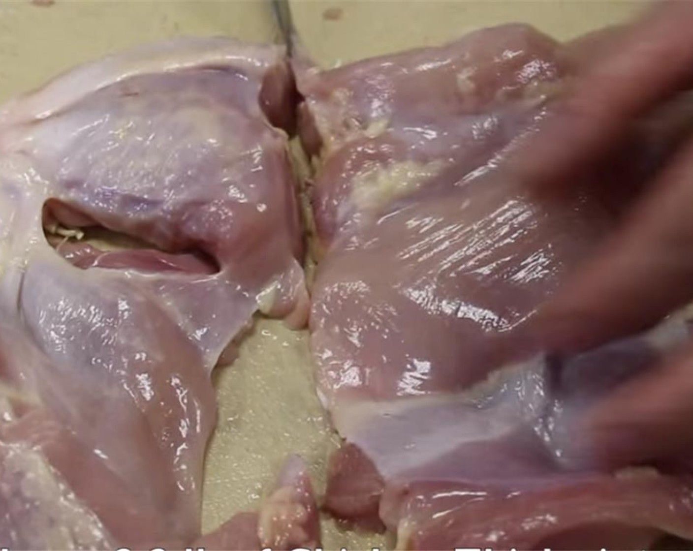 step 3 Cut your deboned Chicken Thighs (2.2 lb) in half.