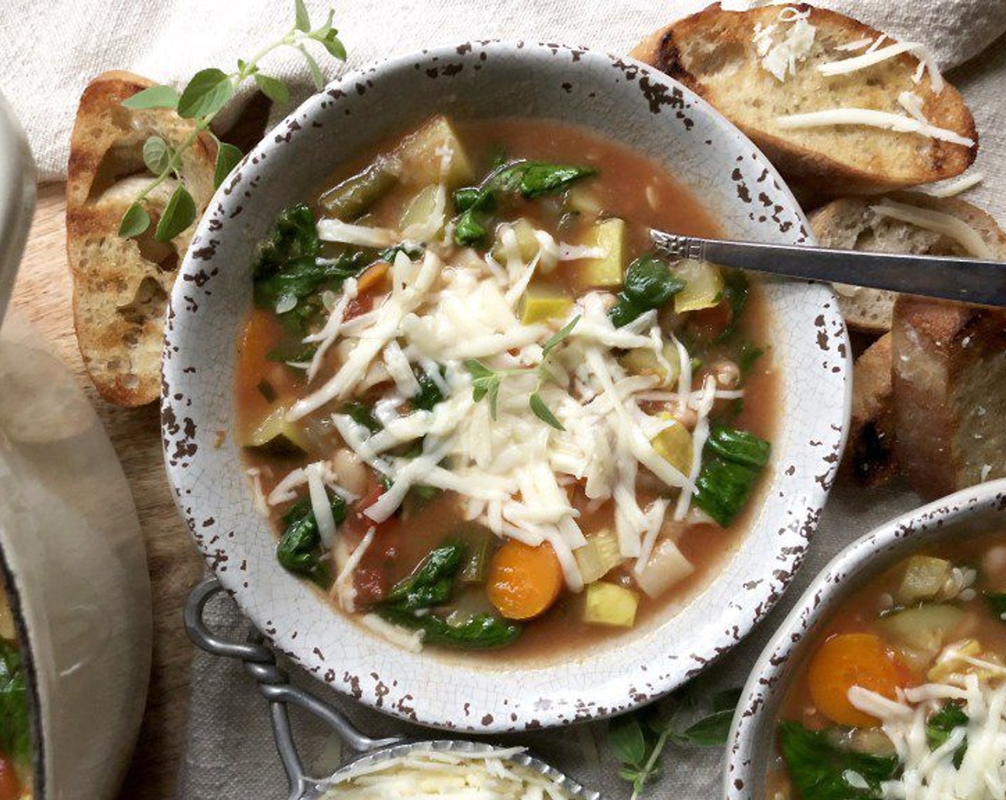 step 8 Ladle soup into individual bowls and top each serving with two tablespoons of the Asiago Cheese (1 cup). If desired, crack some Ground Black Pepper (to taste) over the top.