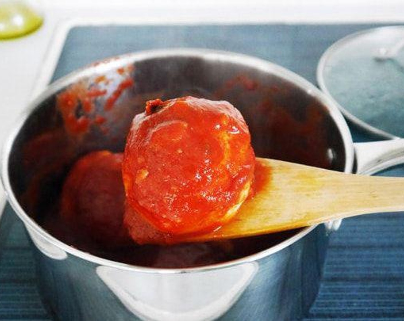 step 3 Halfway of the cooking time baste the balls with tomato sauce, cover and leave to cook for the remaining time. Once the balls are done, carefully with a fish slice or flat wooden spoon remove them from the pot and serve on each individual plate. Grate some Parmesan Cheese (to taste) over each ball. Serve and enjoy!