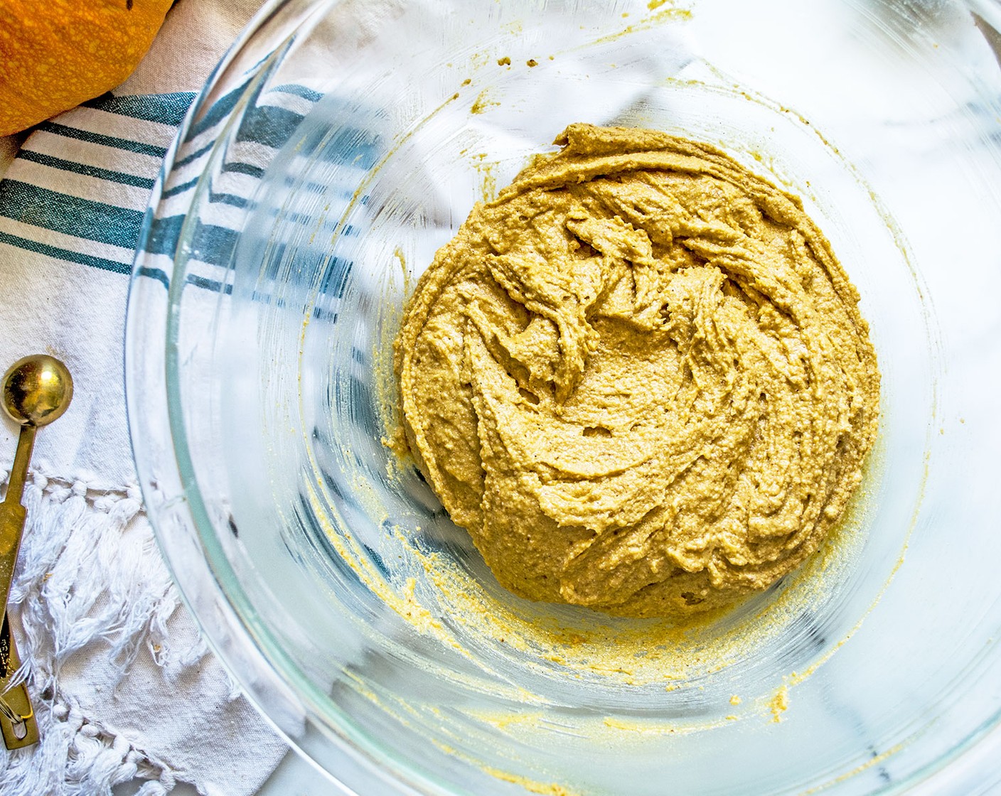 step 3 Create a hole in the center of the crumbly mixture and the Eggland's Best Classic Egg (1), Pumpkin Purée (1/2 cup), and Full-Fat Coconut Milk (4 Tbsp). Stir well until fully incorporated, leaving you with a sticky dough.