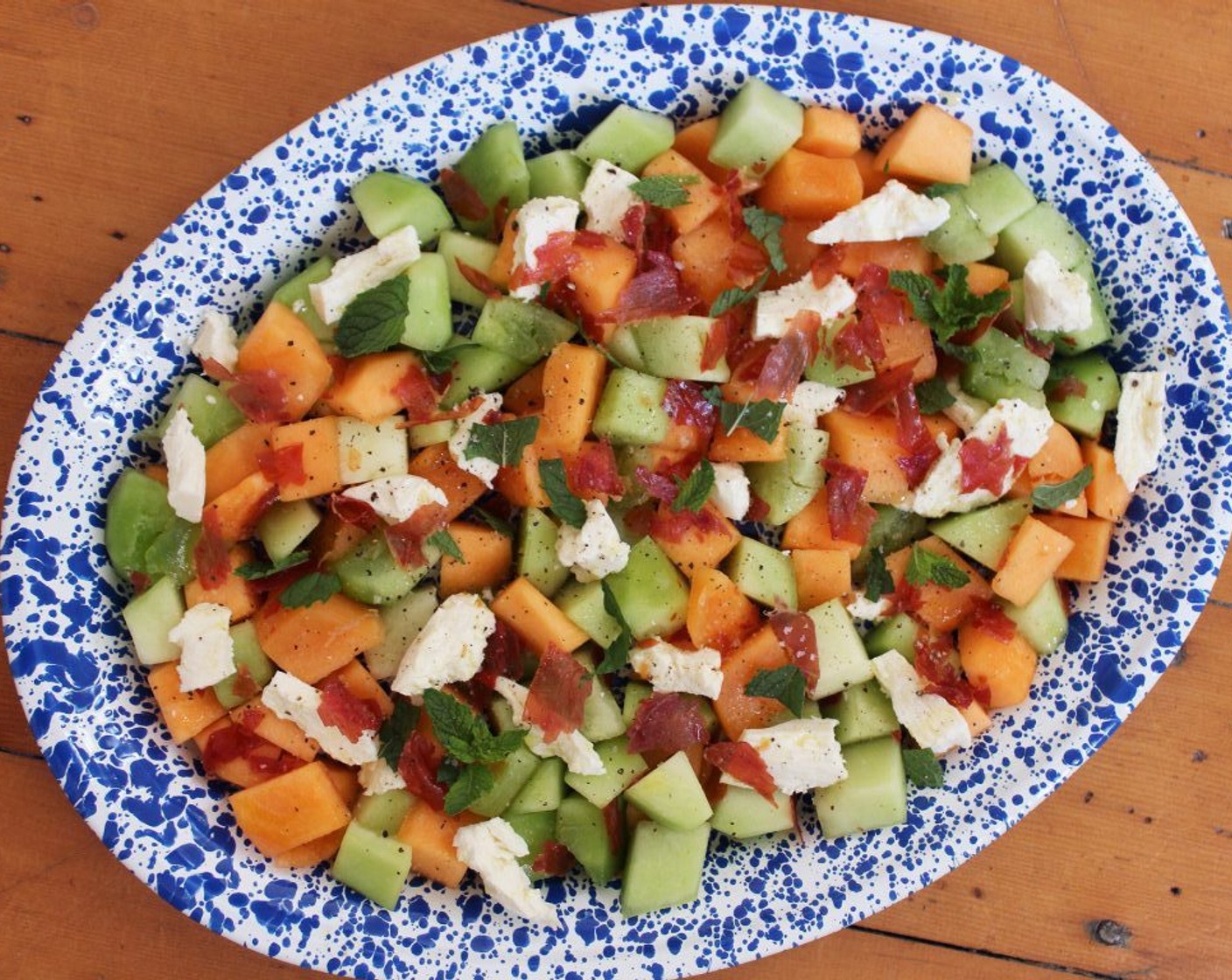 step 7 Tear or roughly chop the Fresh Mint Leaves (1/2 cup), then scatter the mint and pieces of prosciutto over the salad. Serve the salad at room temperature.