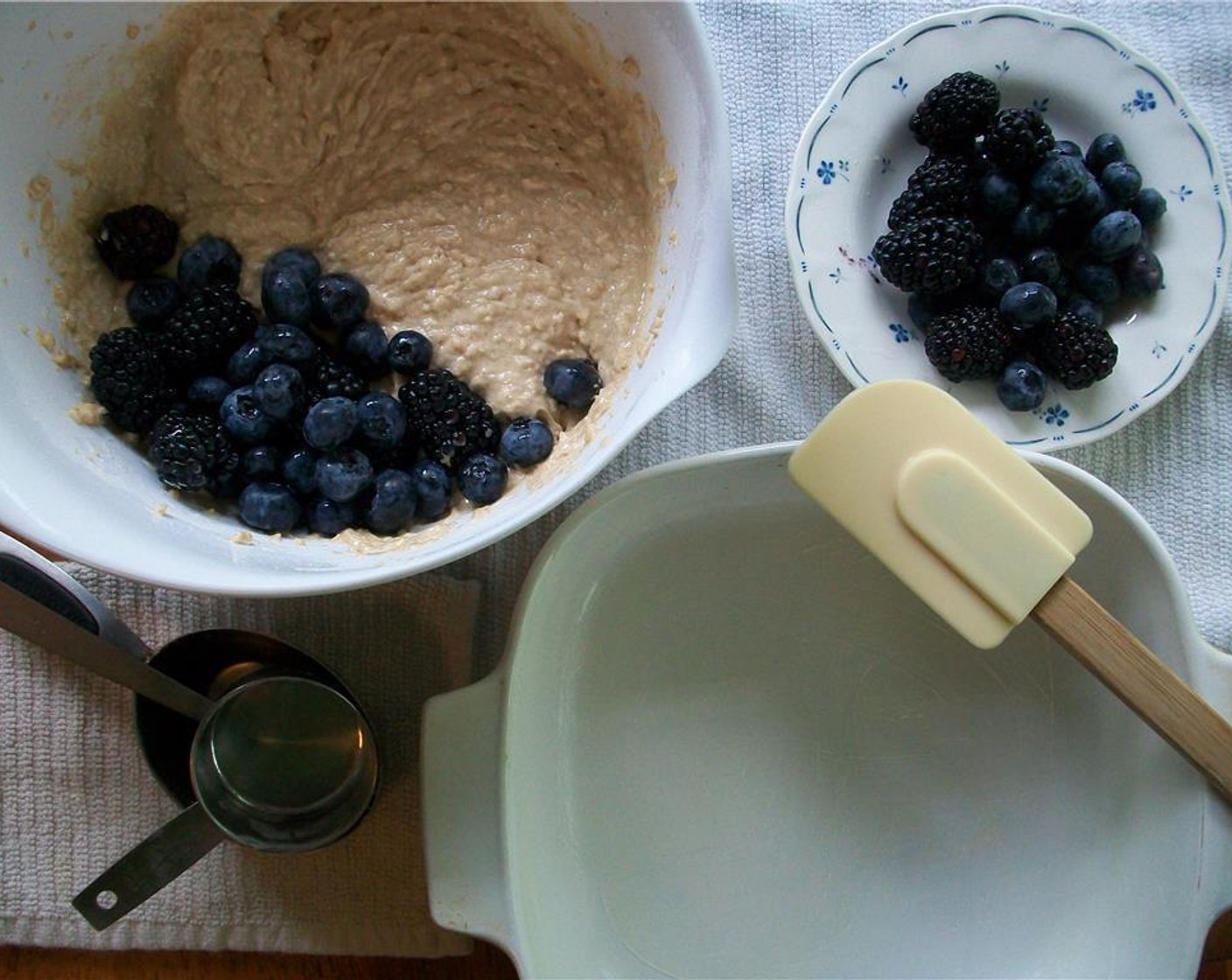 step 4 Add Egg (1) and Vanilla Extract (1 tsp) and beat until combined. Add flour and oat mixtures and mix until combined. Gently fold in half of the Fresh Mixed Berries (2 cups).