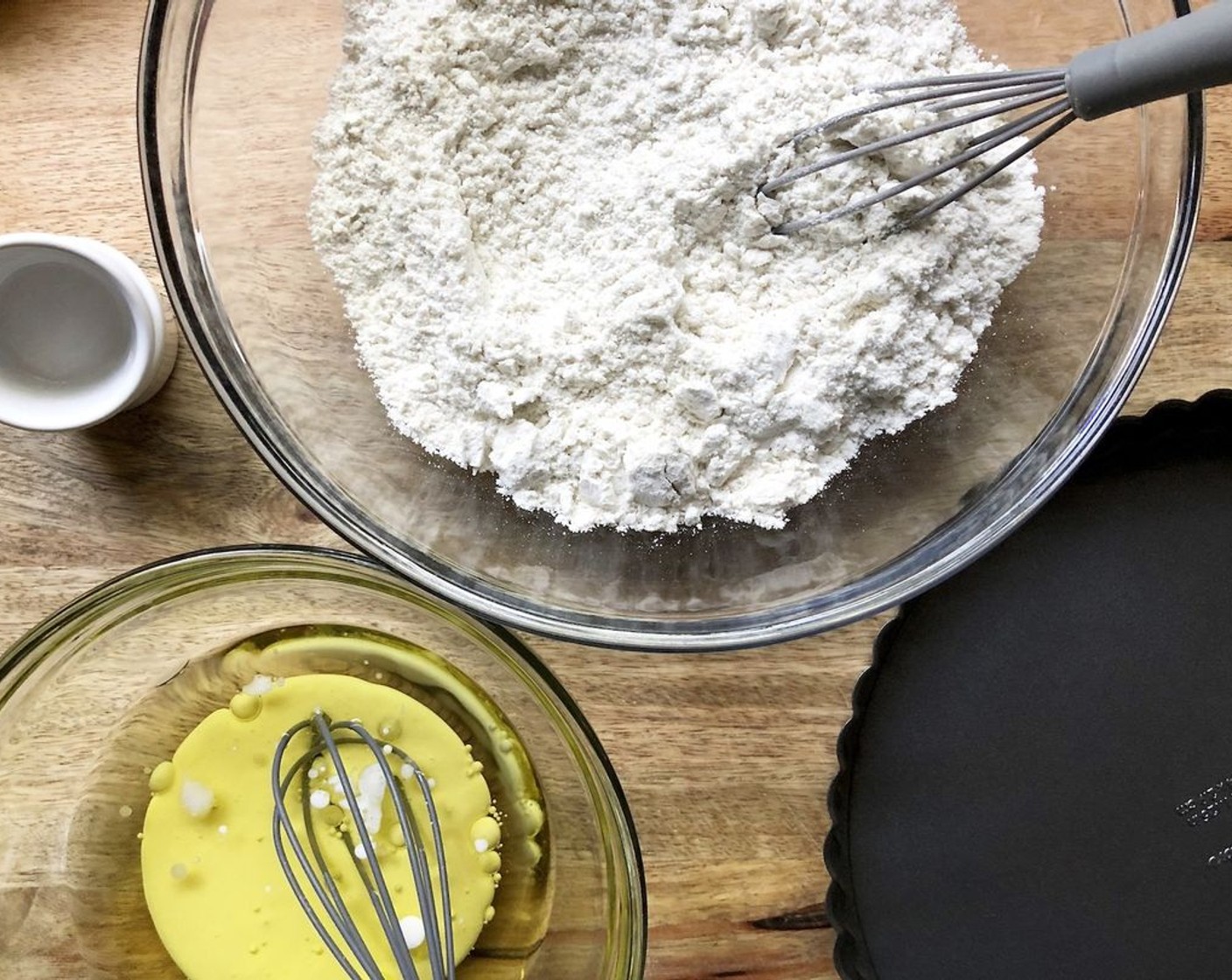 step 2 In a mixing bowl, stir together All-Purpose Flour (1 1/2 cups), Kosher Salt (1/2 tsp), and Granulated Sugar (1 tsp). Stirring enables the salt and sugar to sift the flour, so you don’t need to sift it in advance. In a small bowl, whisk together the Vegetable Oil (4 Tbsp), Olive Oil (4 Tbsp), Whole Milk (2 Tbsp), and Almond Extract (1 tsp).