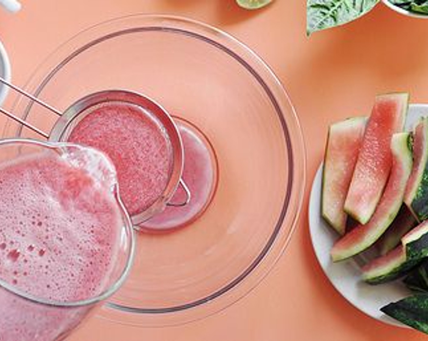 step 3 Slice up the Watermelon (1) in half and scoop the flesh. Place it into a blender or food processor. Blend until completely smooth and juiced. Pour the watermelon juice through a fine-mesh strainer, into a large bowl or separate pitcher