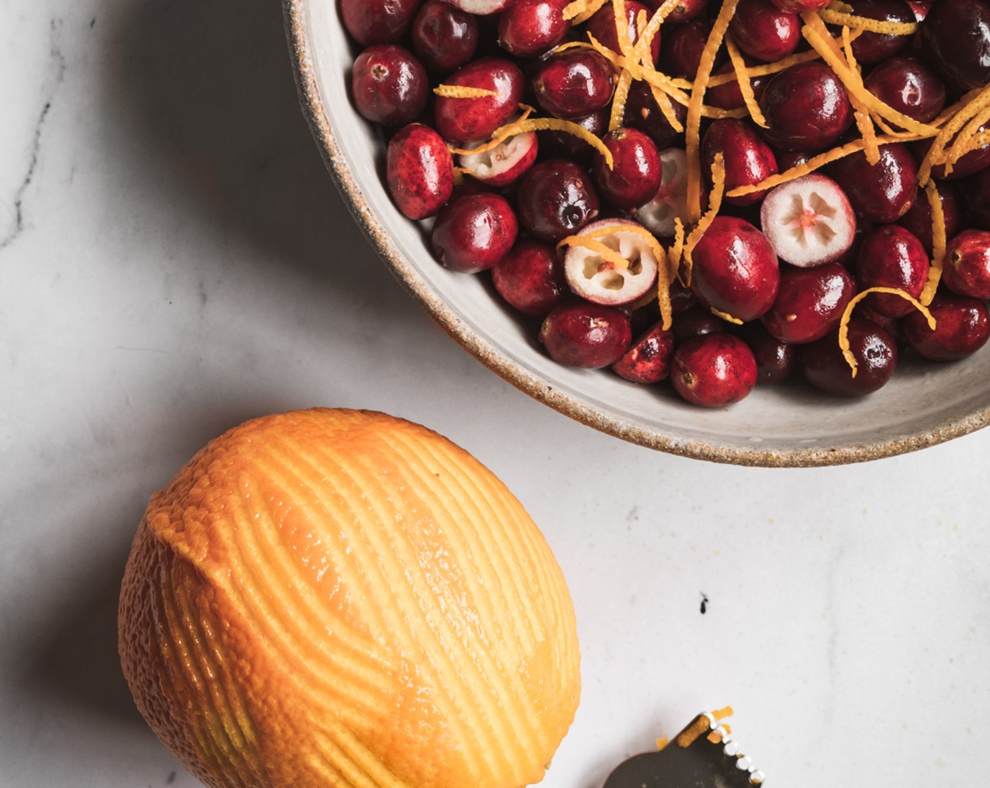 step 3 Use a citrus zester to zest the Orange (1), add zest to the bowl of prepared cranberries.