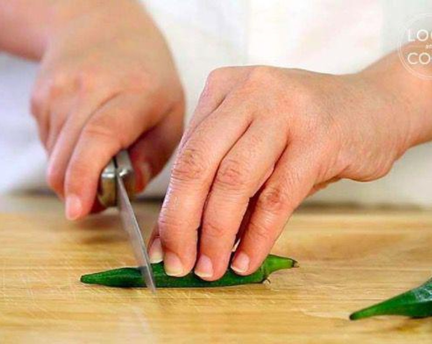 step 1 Wash and rinse Okra (2 1/2 cups). Remove the top and tail and slit okra into two pieces.