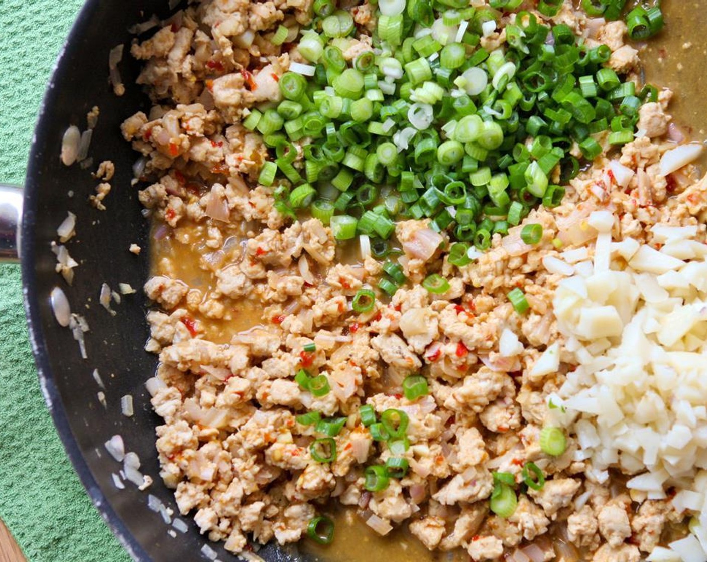 step 7 Add the green onions and water chestnuts. Stir until combined and cook over medium heat for 3 minutes, or until heated through.