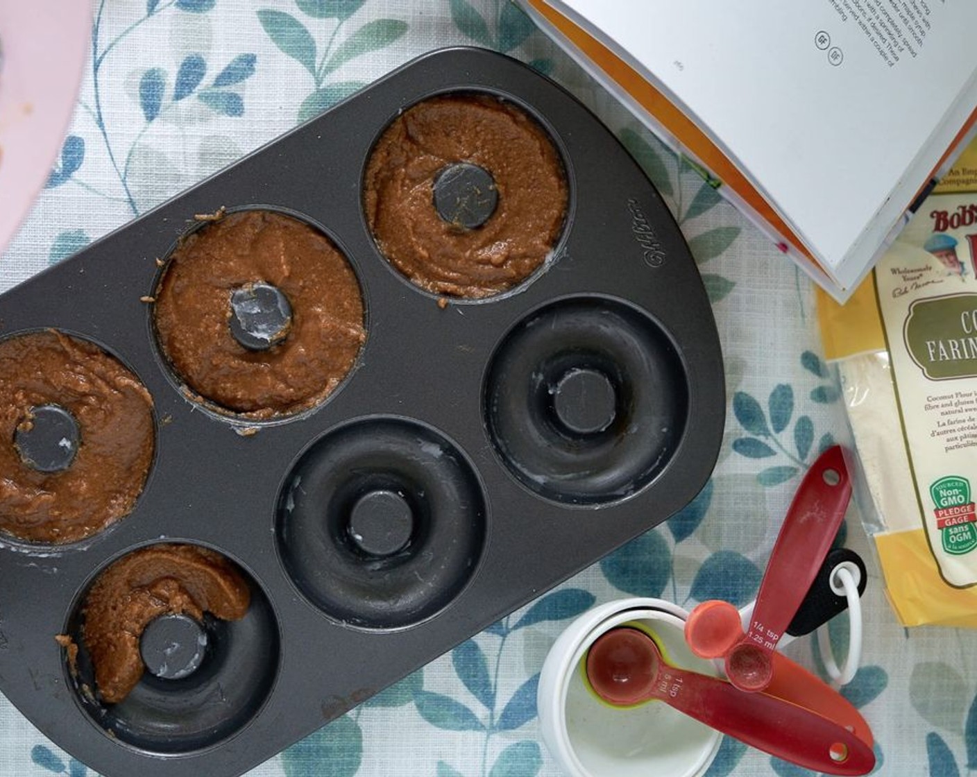 step 3 Make a well in the center of the dry ingredients and add Eggs (6), Avocado Oil (1/4 cup), and Vanilla Extract (1 tsp). Using a wooden spoon, stir the batter together until well combined. Spoon into the prepared donut pan.