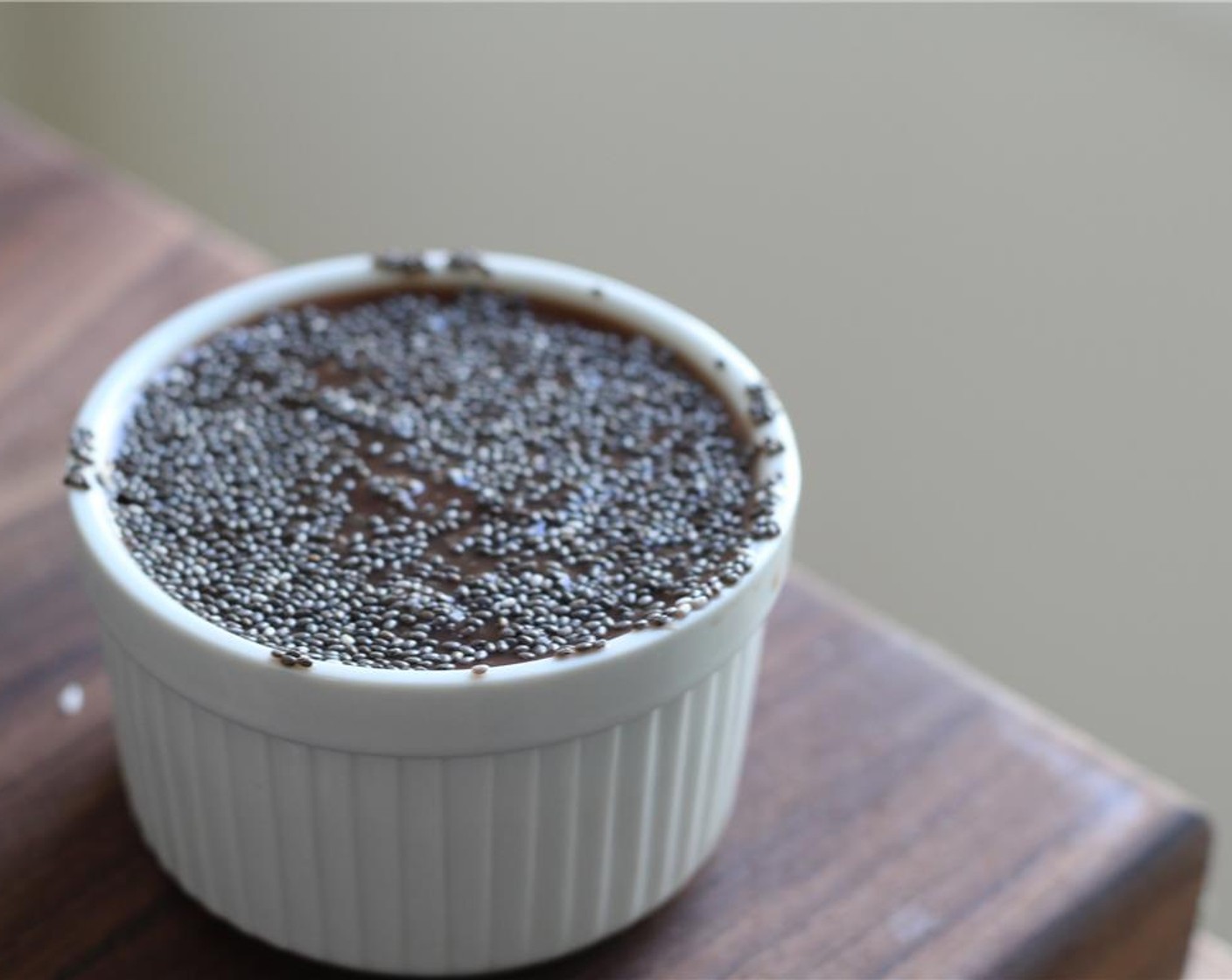 step 1 Stir the Chia Seeds (3 Tbsp) into the Chocolate Coconut Water (1 cup) and allow to sit at room temperature for 10 minutes or until the mixture begins to gel.