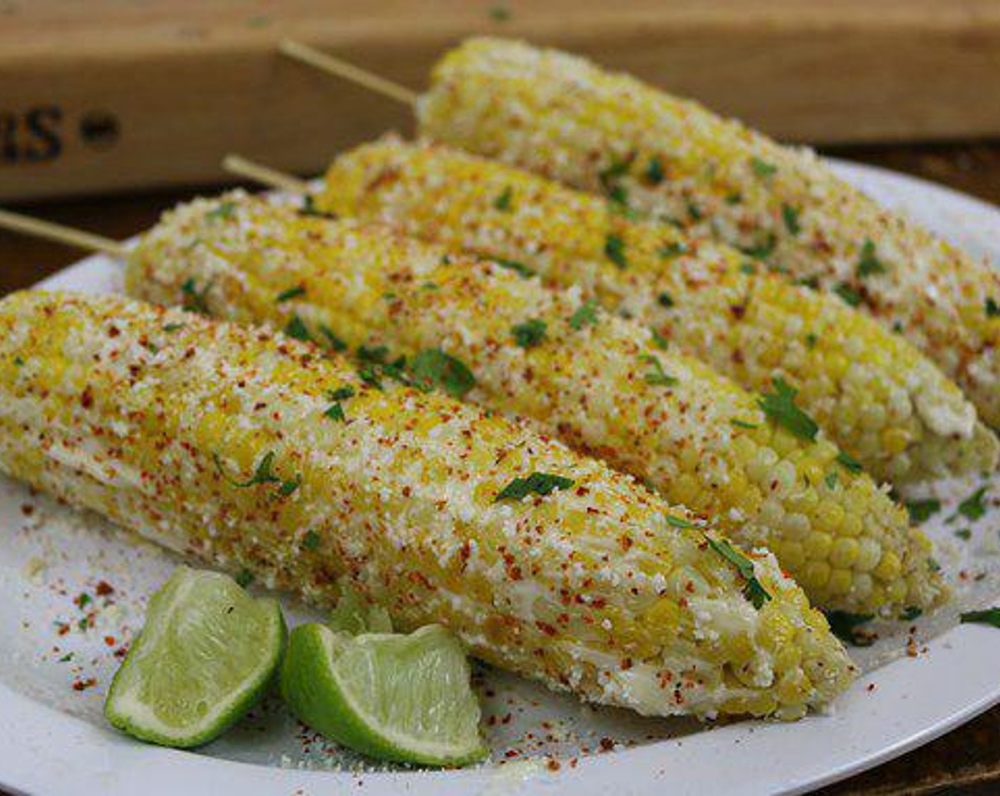 step 3 For this grilled corn on the cob recipe, I decided to do my take on a Mexican style street corn. Once I remove the grilled corn on the cob from the grill and remove the shuck and silks, I apply a layer of Mayonnaise (to taste) and Cotija Cheese (to taste). Then sprinkle some Tajin (to taste), a squirt of Limes (to taste) and Fresh Cilantro (to taste). And that is how you make grilled Mexican street corn, serve and enjoy.