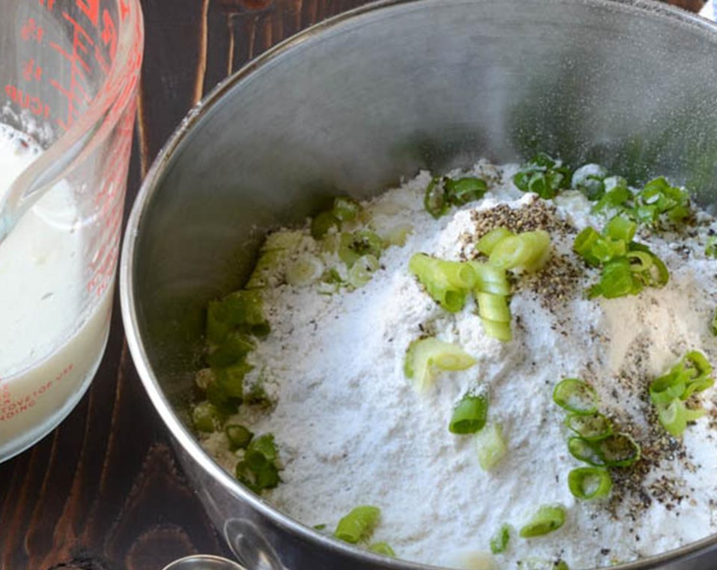 step 8 For the biscuit topping, in a medium bowl combine the All-Purpose Flour (1 3/4 cups), Baking Powder (1 tsp), Baking Soda (1/2 tsp), Salt (1/2 tsp), Ground Black Pepper (1/2 tsp), and sliced Scallion (1 bunch).