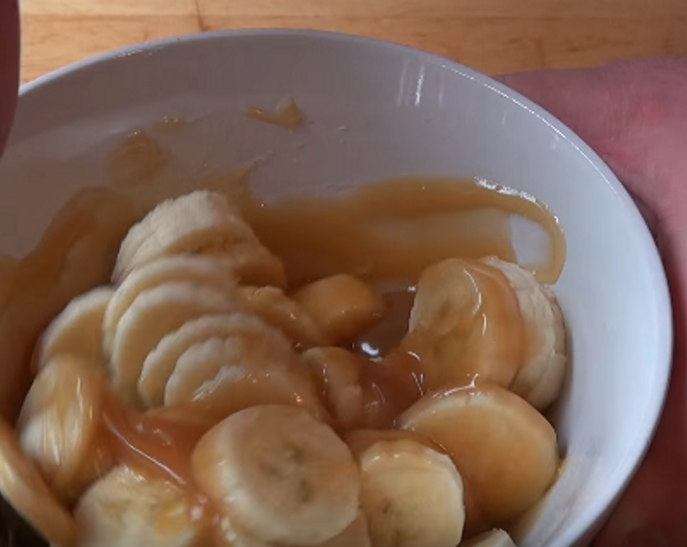 step 2 In a bowl, warm Toffee Sauce (1/2 cup) in the microwave. Add sliced Bananas (2) to warmed sauce and gently toss.