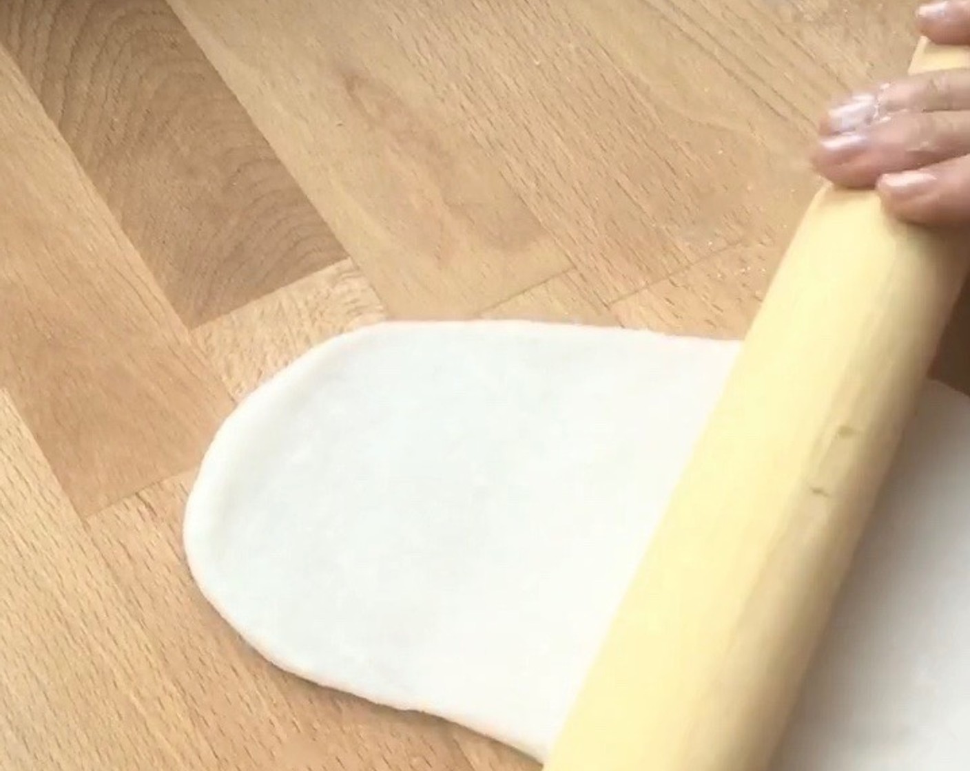 step 14 First, lightly dust the working surface and rolling pin with some tapioca flour. Then roll out the dough into a thin layer.