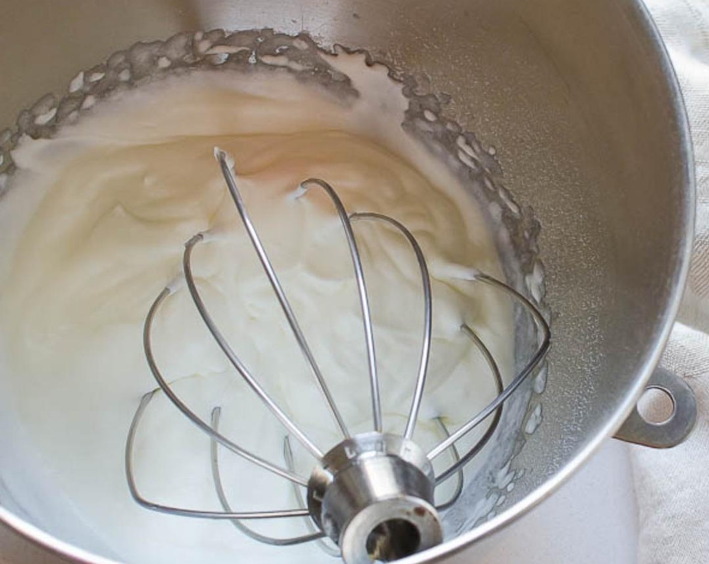 step 6 Add the Heavy Cream (2 cups)  to the bowl of a stand mixer. Whip the cream for one minute at medium speed.