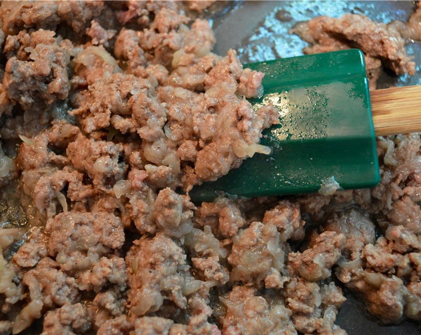 step 2 Add Ground Beef (8 oz) and cook until beef begins to brown. Then add Canned Crushed Tomatoes (1 cup) and Fresh Parsley (1/2 cup). Season with Salt (1/2 tsp) and pepper. Cook for 2-3 minutes and set aside.
