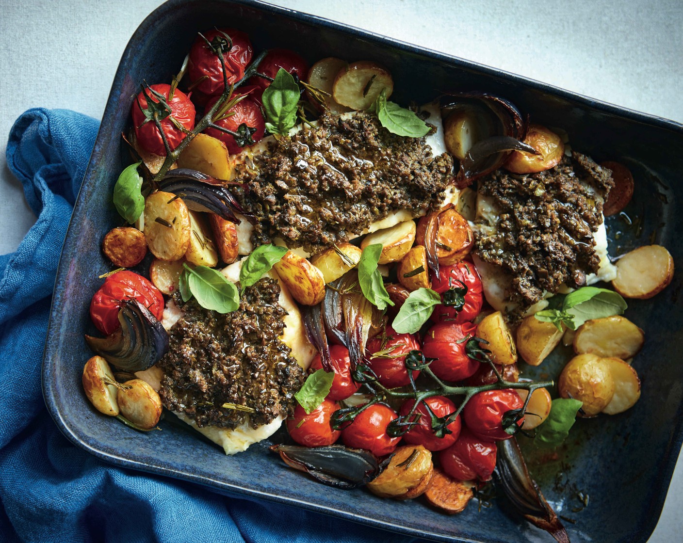 Haddock with olive tapenade and roasted tomatoes M&S