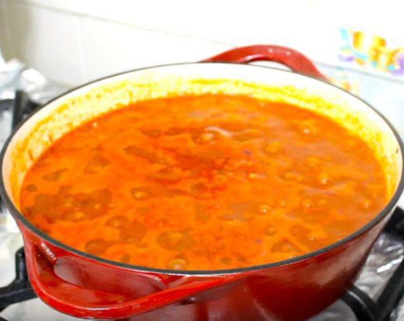 step 3 Add Tomato Paste (3 Tbsp), Chili Powder (1 Tbsp), Ground Cumin (1/2 tsp), Dried Oregano (1/2 tsp), Canned Crushed Tomatoes (3 1/3 cups), GOYA® Black Beans (2 1/3 cups), Chicken Broth (2 cups), and Hot Sauce (1 tsp). Mix together until well combined.
