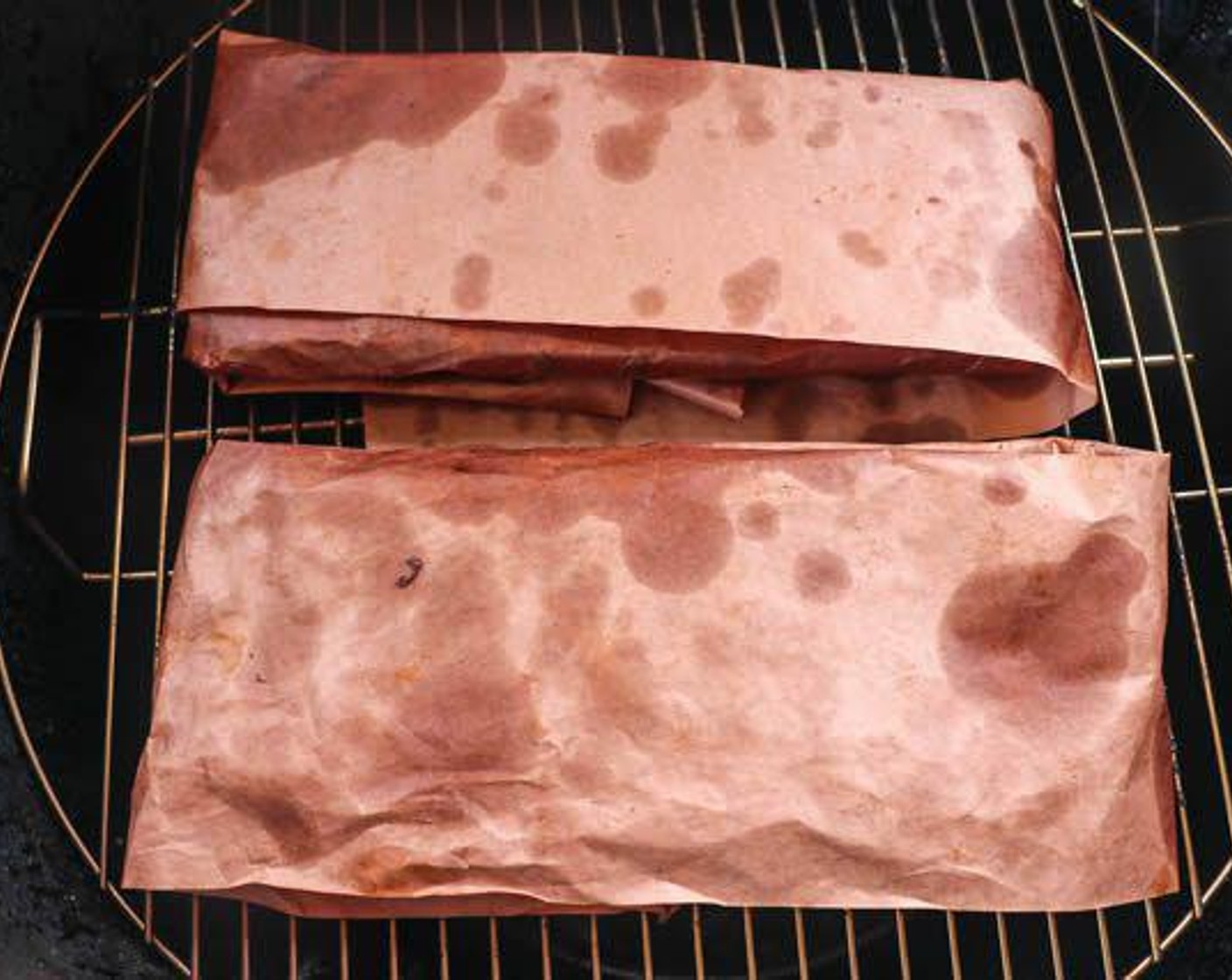 step 5 Wrap each slab in Peach Butcher paper (un-waxed) and place back on the pit for 1 ½ hours or until tender.
