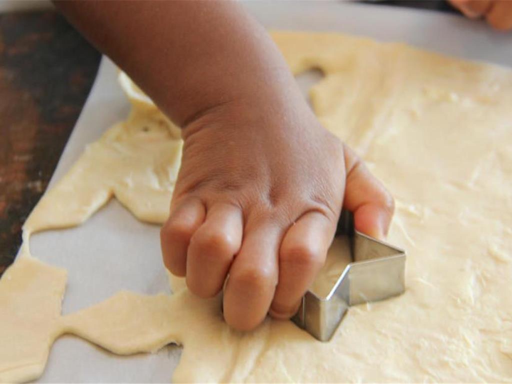 Step 3 of Easy Peasy Cheesy Puffs Recipe: Cut shapes from puff pastry using a cookie cutter.