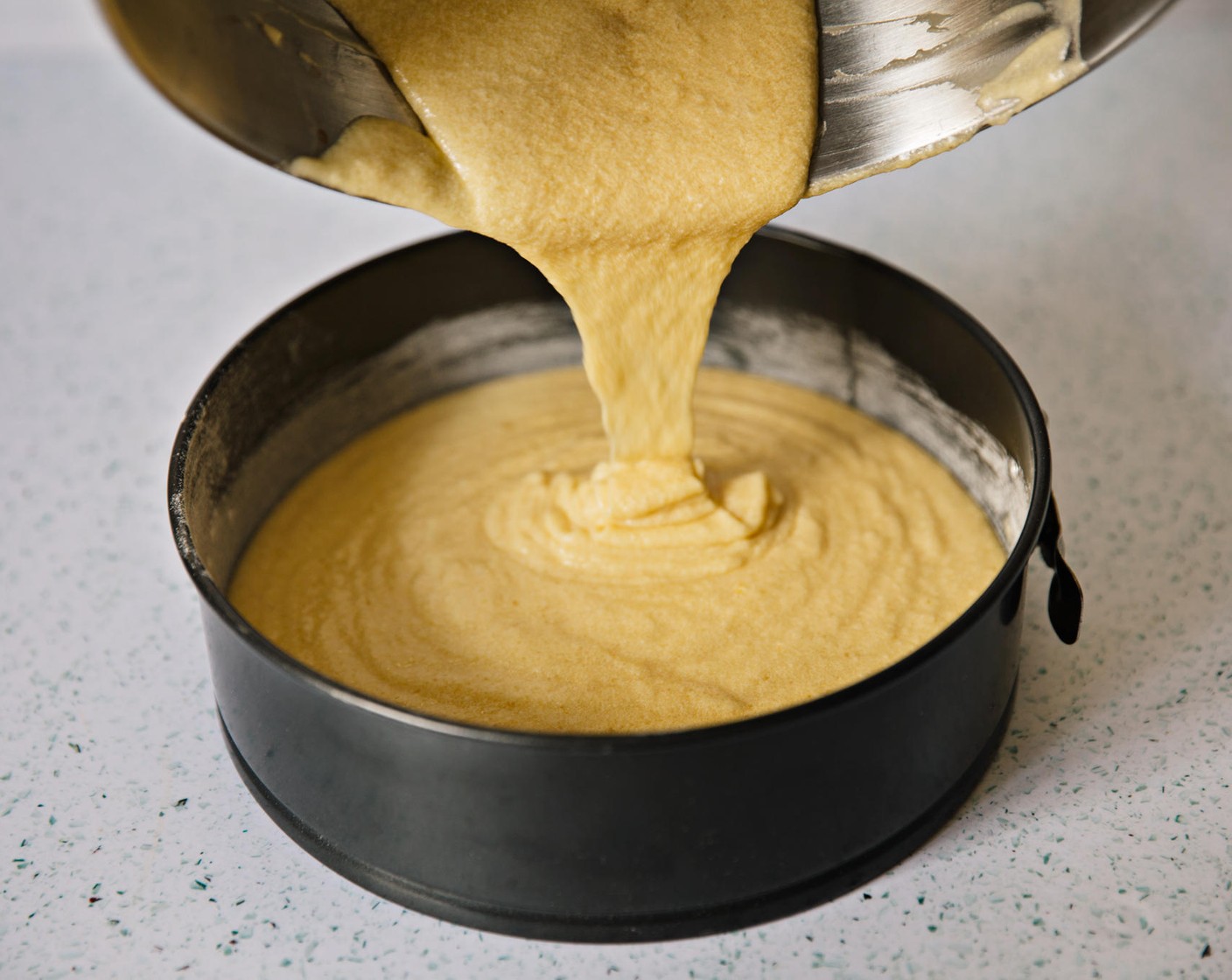 step 12 Pour cake batter into prepared tin.