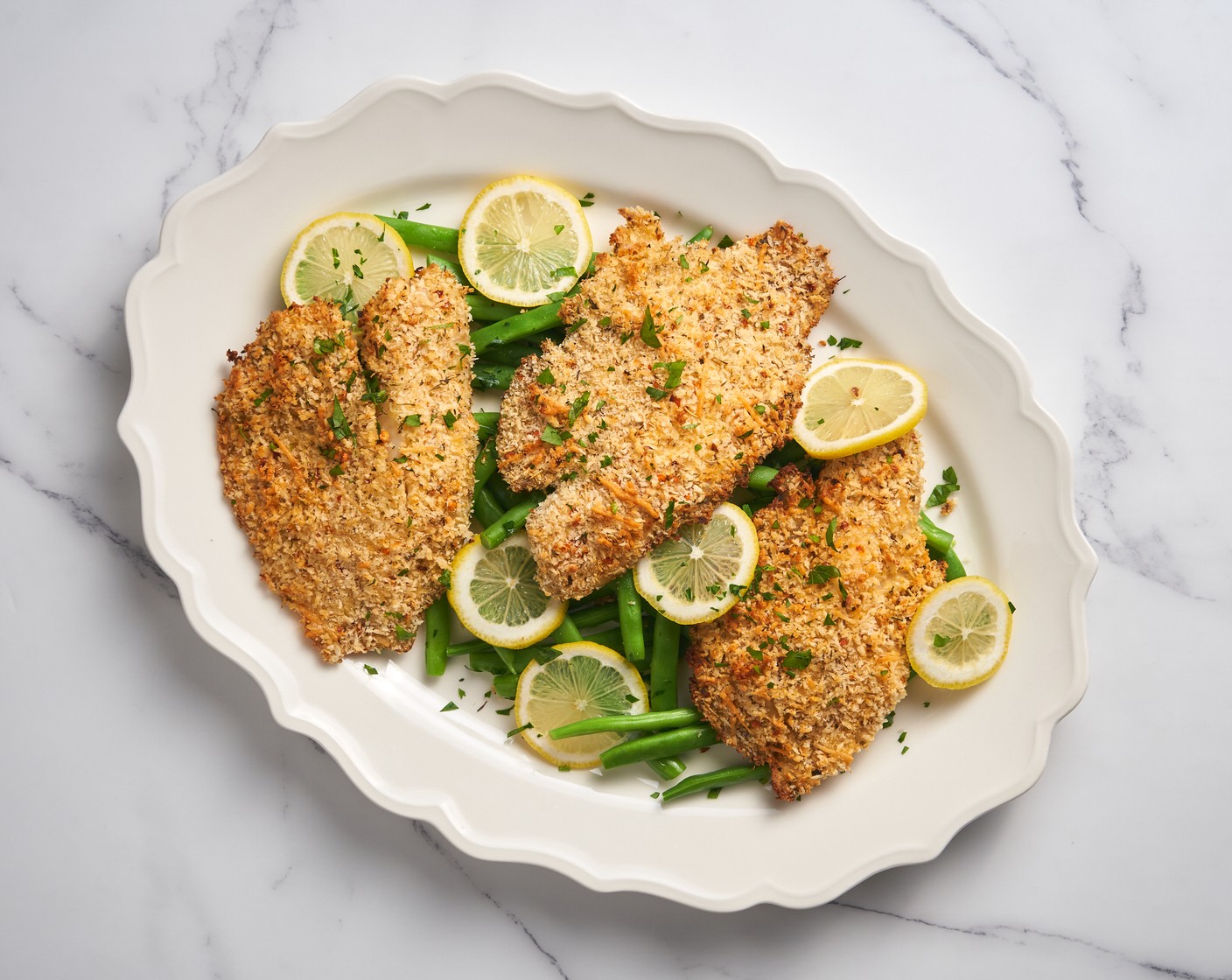 step 7 Garnish with Fresh Parsley (1 Tbsp). Serve warm with a Lemon Wedges (1) and Green Beans (1 cup), as you desire.