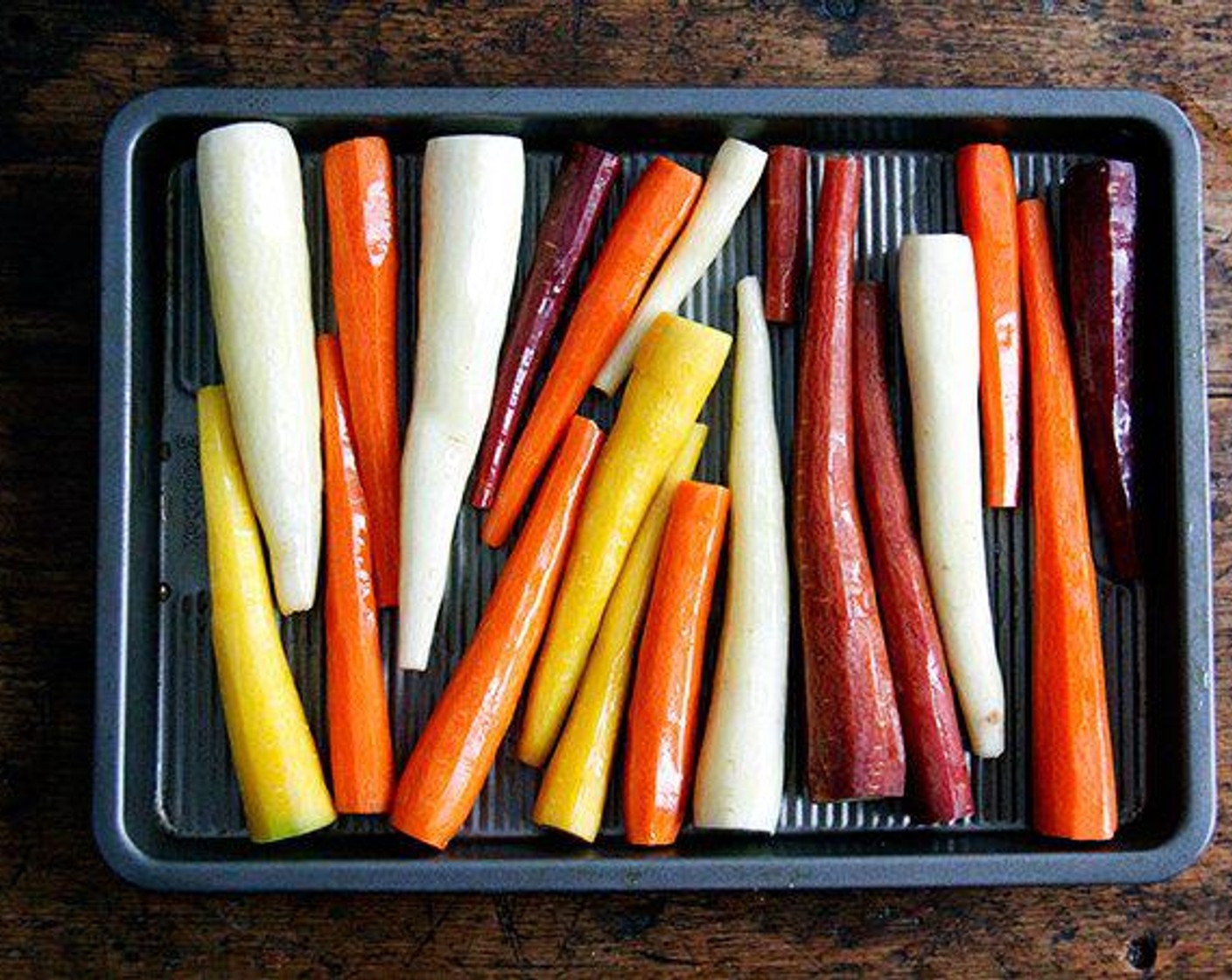step 2 Spread the Carrots (4 1/2 cups) on a rimmed baking sheet, drizzle on Extra-Virgin Olive Oil (1 Tbsp), and roll the carrots to coat them. Roast until they are very dark brown, even a bit burnt on the edges, but not fully tender, 10 to 12 minutes.