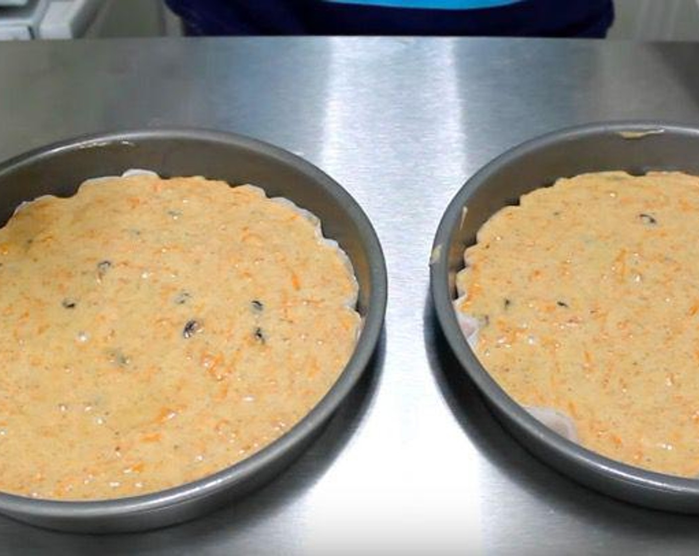 step 5 Transfer batter to two lightly greased 8-inch cake pans lined with parchment paper.