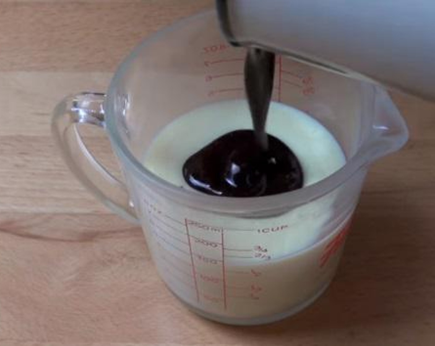 step 2 Then, into a separate mug, add and mix together the Sweetened Condensed Milk (2/3 cup), and coffee mixture.