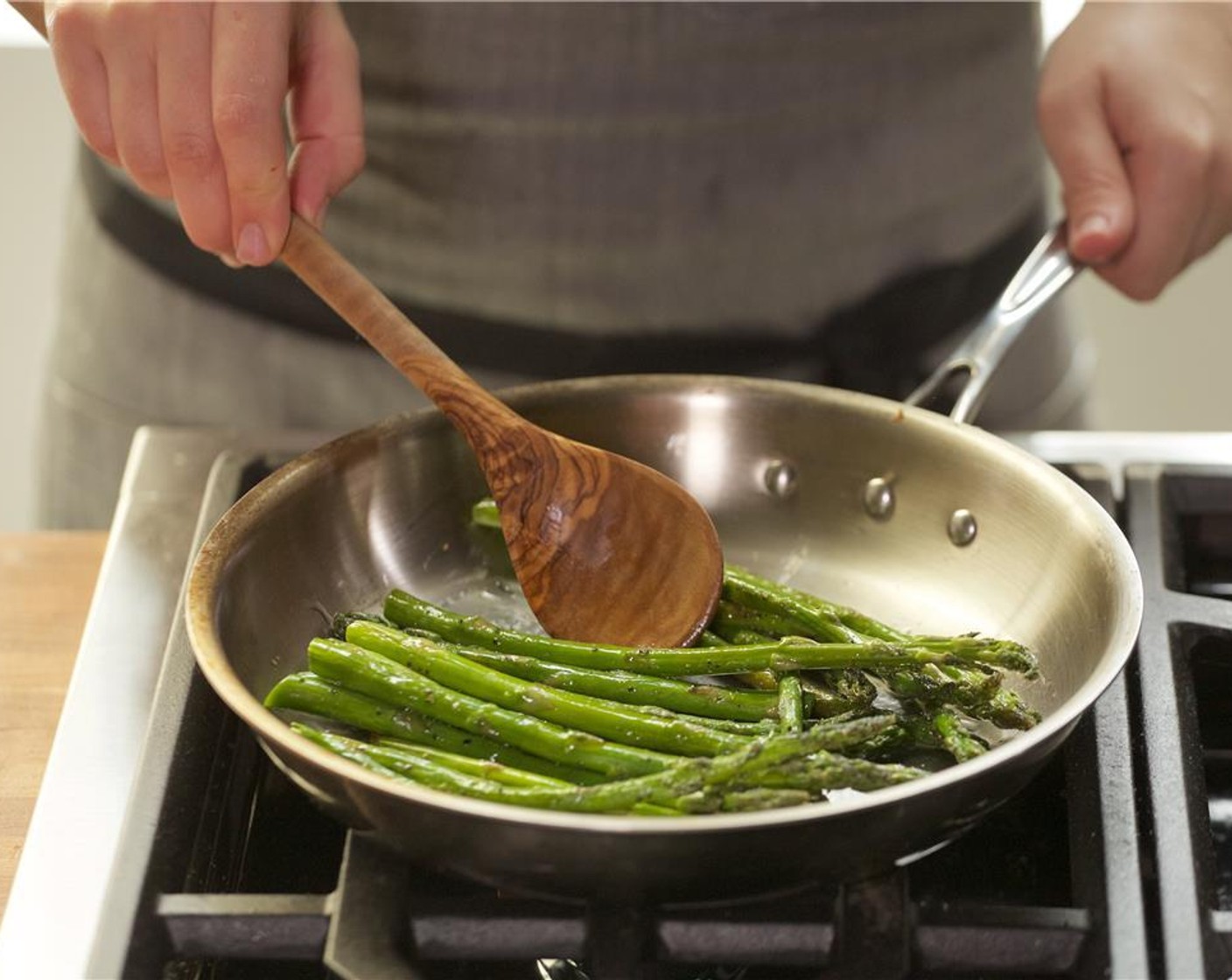 step 13 In a medium sauté pan over medium-high heat, add one tablespoon of oil. When hot, add the asparagus, Salt (1/4 tsp) and Ground Black Pepper (1/2 tsp). Saute for two to three minutes until cooked, and set aside.