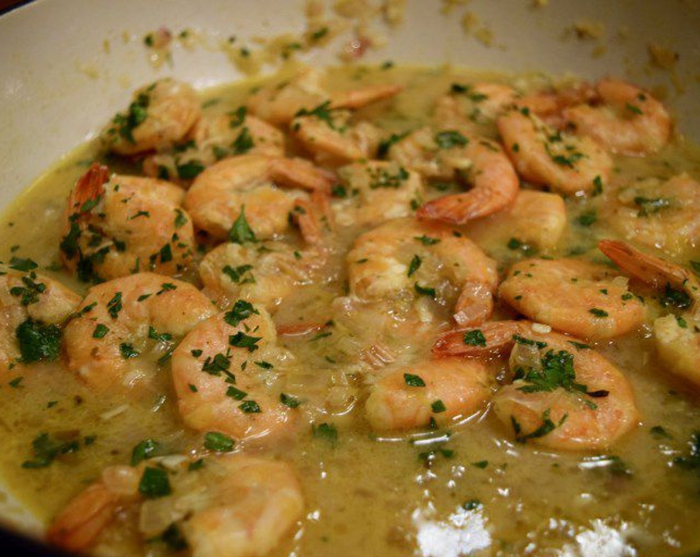step 5 Turn the heat down to low and cook for 5-7 minutes until the shrimp are pink and cooked through. Top with Fresh Parsley (to taste) and serve with bread or french fries.