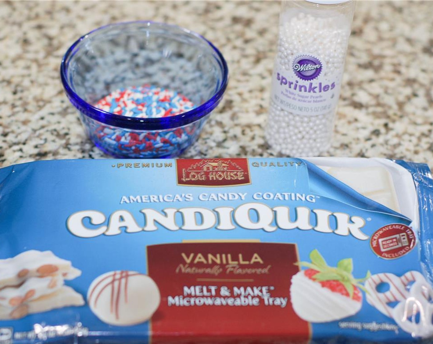 step 6 When the balls have set, melt the CANDIQUIK® Vanilla Candy Coating (1 pckg) in the microwave as per directions on the package.
