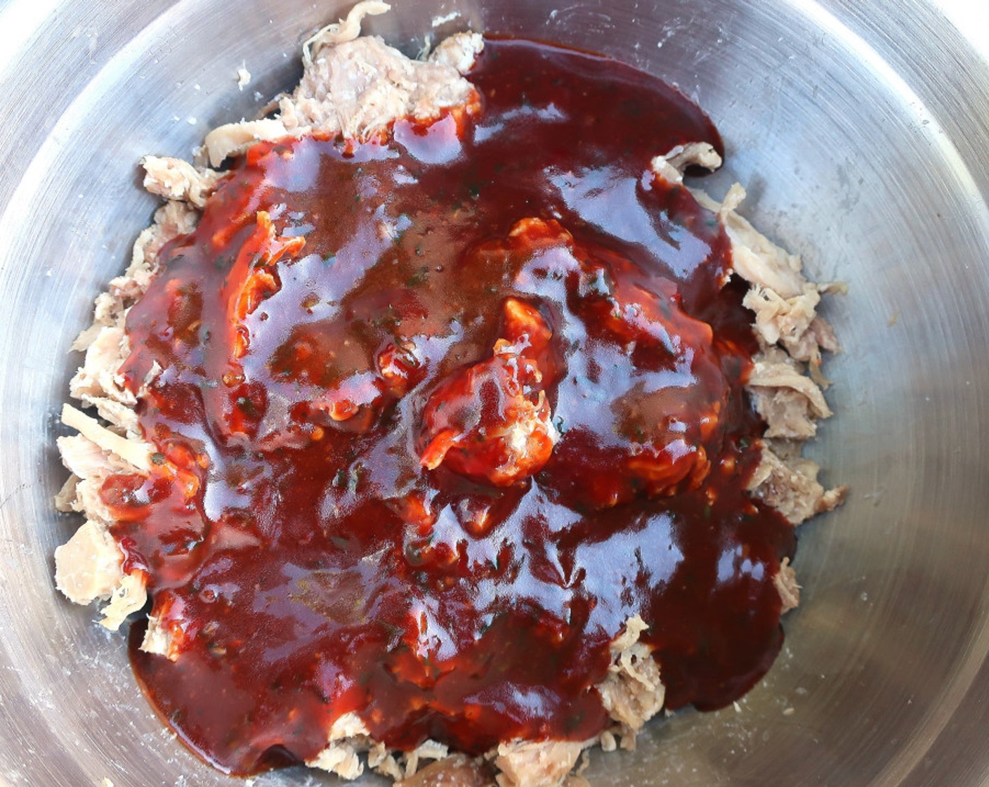 step 7 Mix the BBQ hoisin sauce with the shredded meat and the chopped chicharrones.