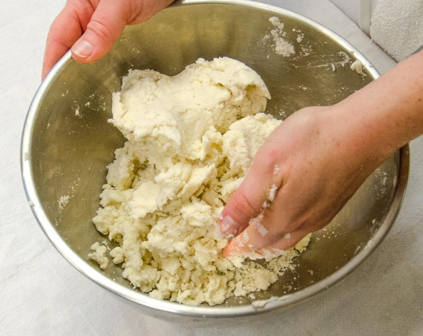 step 5 Gently mix until the dough just comes together, add an additional 2 tablespoons of ice water, if needed.