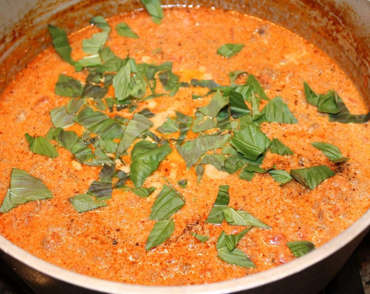 step 9 Add Fresh Basil (1/4 cup) and Parmesan Cheese (1/2 cup) to sauce.