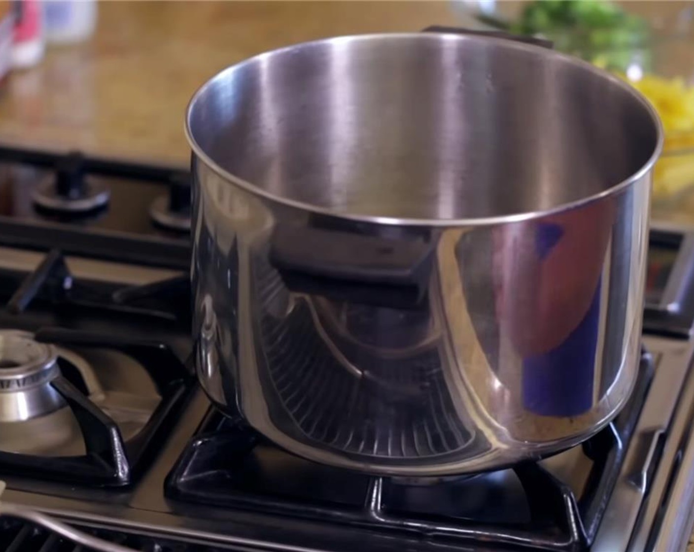 step 4 While the onions and garlic cook, fill a large pot ⅔ full with water and bring to a boil.