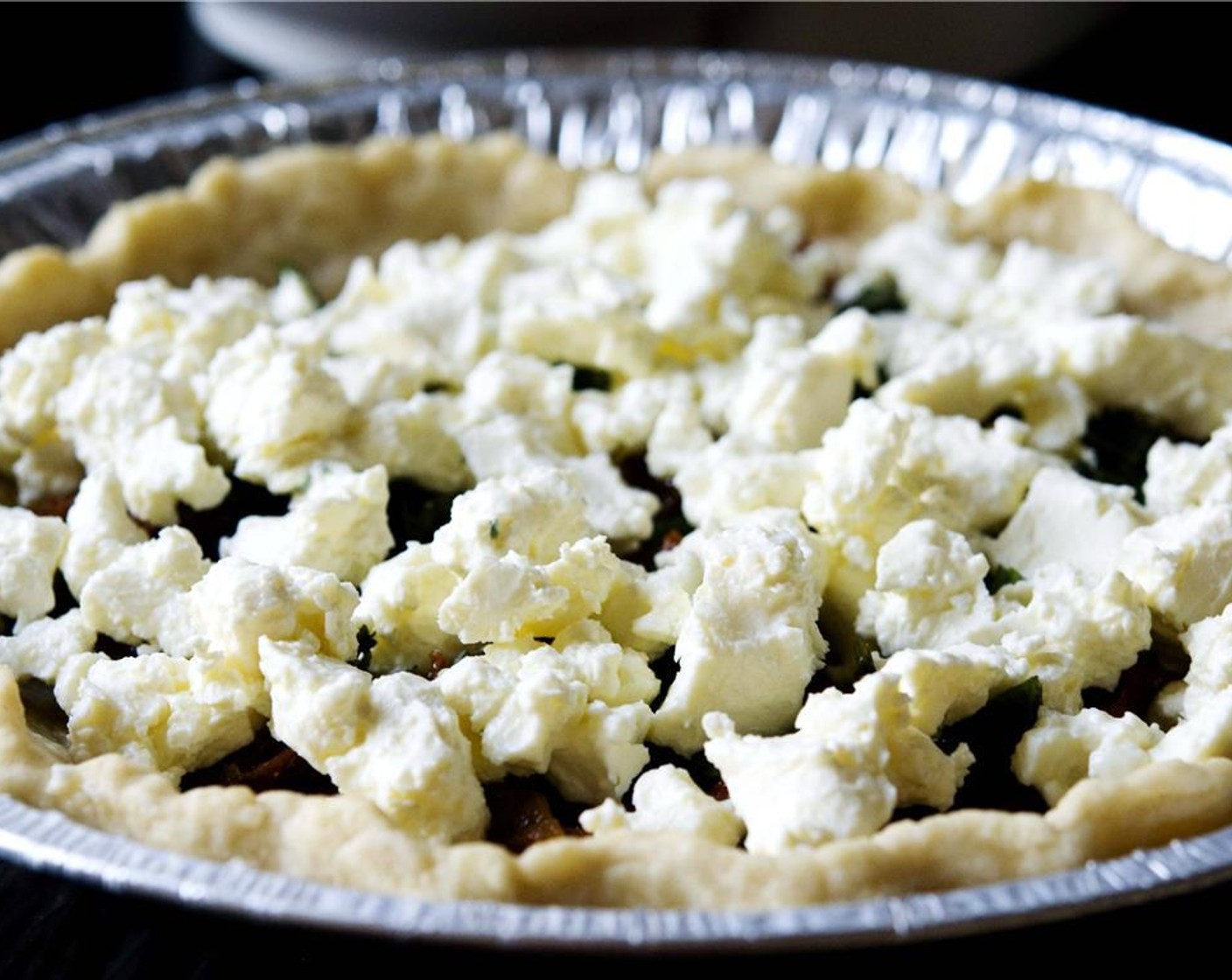 step 7 Crumble the Feta Cheese (1 1/3 cups) and add it to the pie.