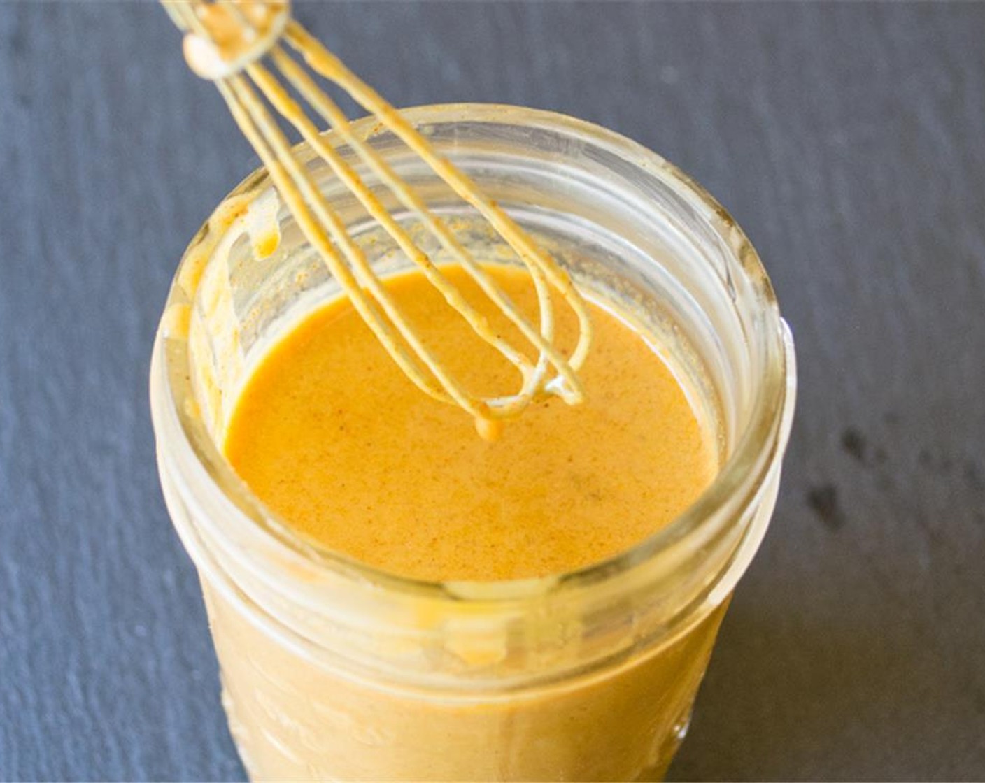 step 9 Make dressing by either whisking or blending Balsamic Vinegar (1 Tbsp), Apple Cider Vinegar (1 Tbsp), Extra-Virgin Olive Oil (1 Tbsp), Honey (1 1/2 Tbsp), Almond Butter (1 1/2 Tbsp), Greek Yogurt (3 Tbsp), Water (3 Tbsp), Garlic (1/4 clove), Smoked Paprika (1/4 tsp), and Ground Turmeric (1/2 tsp) in a bowl or food processor until smooth.