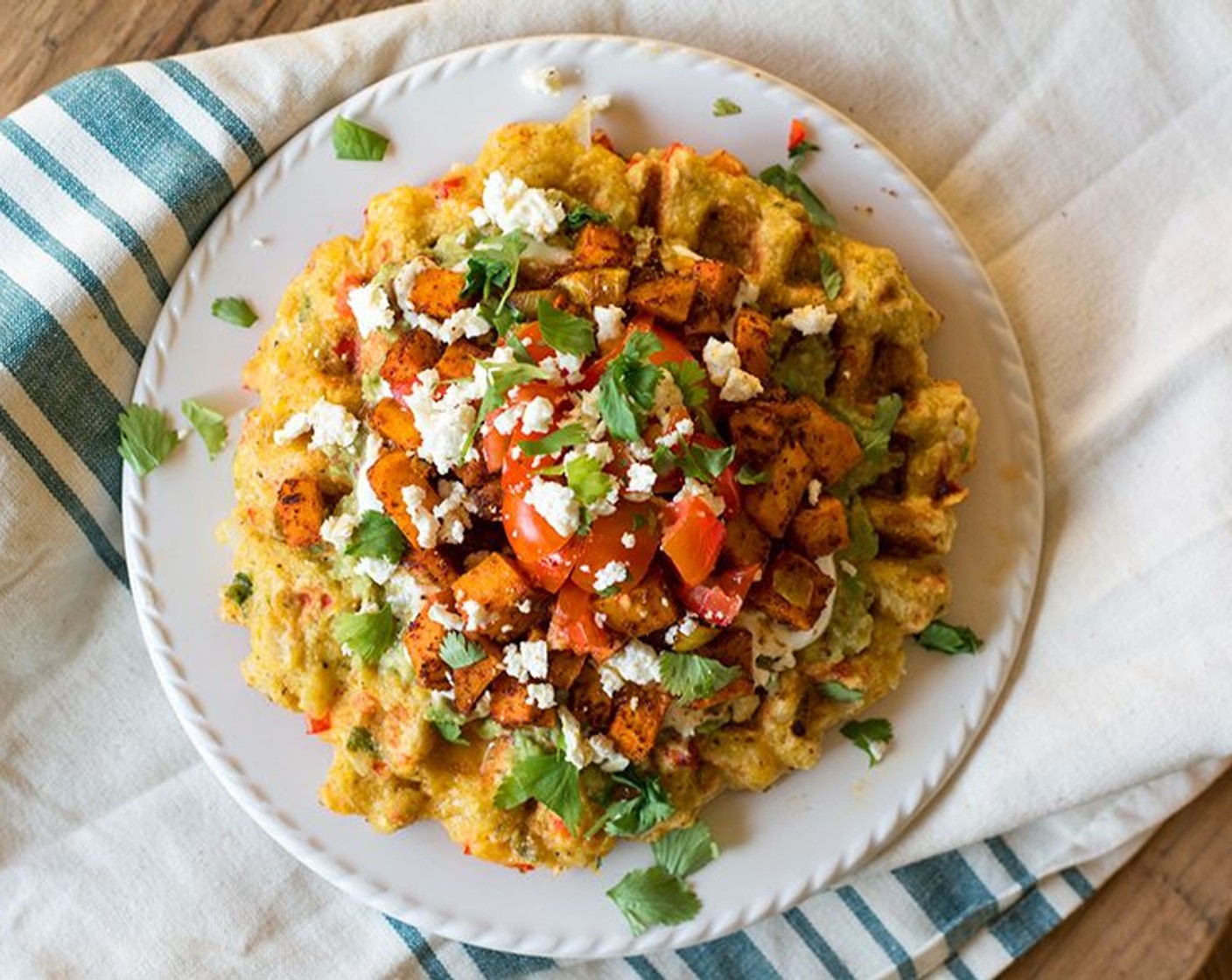 step 13 Add the cooked sweet potato and onions over salsa, then top with other desired toppings. I used Cherry Tomatoes (4), Feta Cheese (3 Tbsp), and Fresh Cilantro (2 Tbsp).