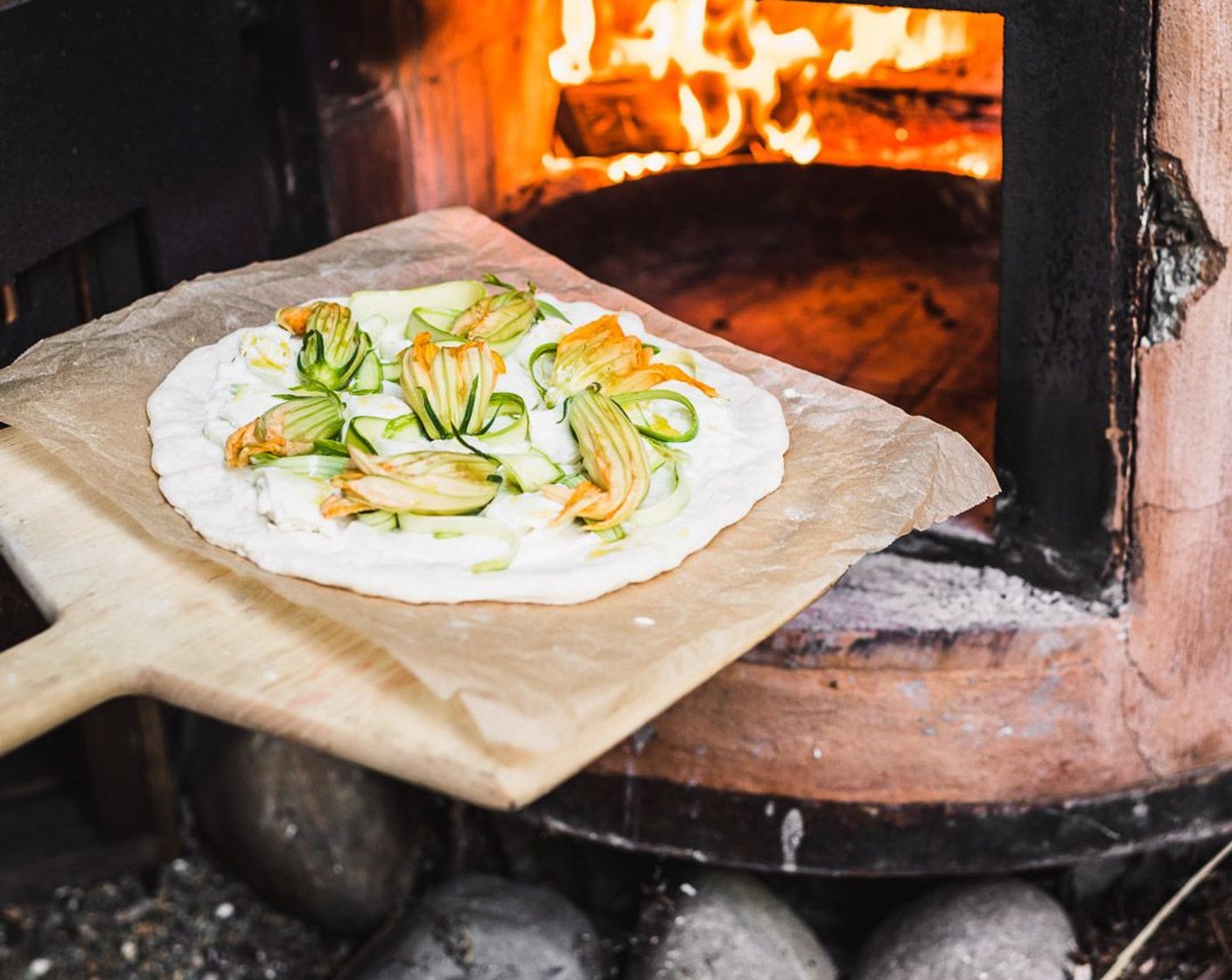 step 11 Once you’re ready to bake your pizza, slide your pizza onto the stone, turn off the oven and set the broiler to high – the pizza should cook to perfection in 4-7 minutes (the time depends on your preferred doneness)