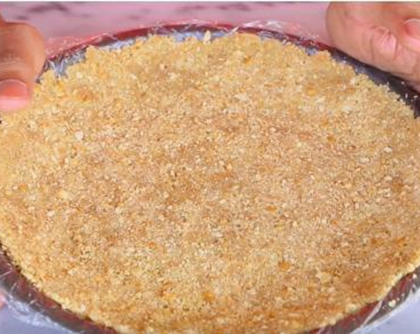 step 1 Inside a bowl, mix together the Graham Cracker Crumbs (1 cup), Butter (1/2 cup) and Caster Sugar (4 Tbsp). Then place and the mixture inside a pie tin lined with a plastic paper, pop it in the fridge until you are ready to use it.