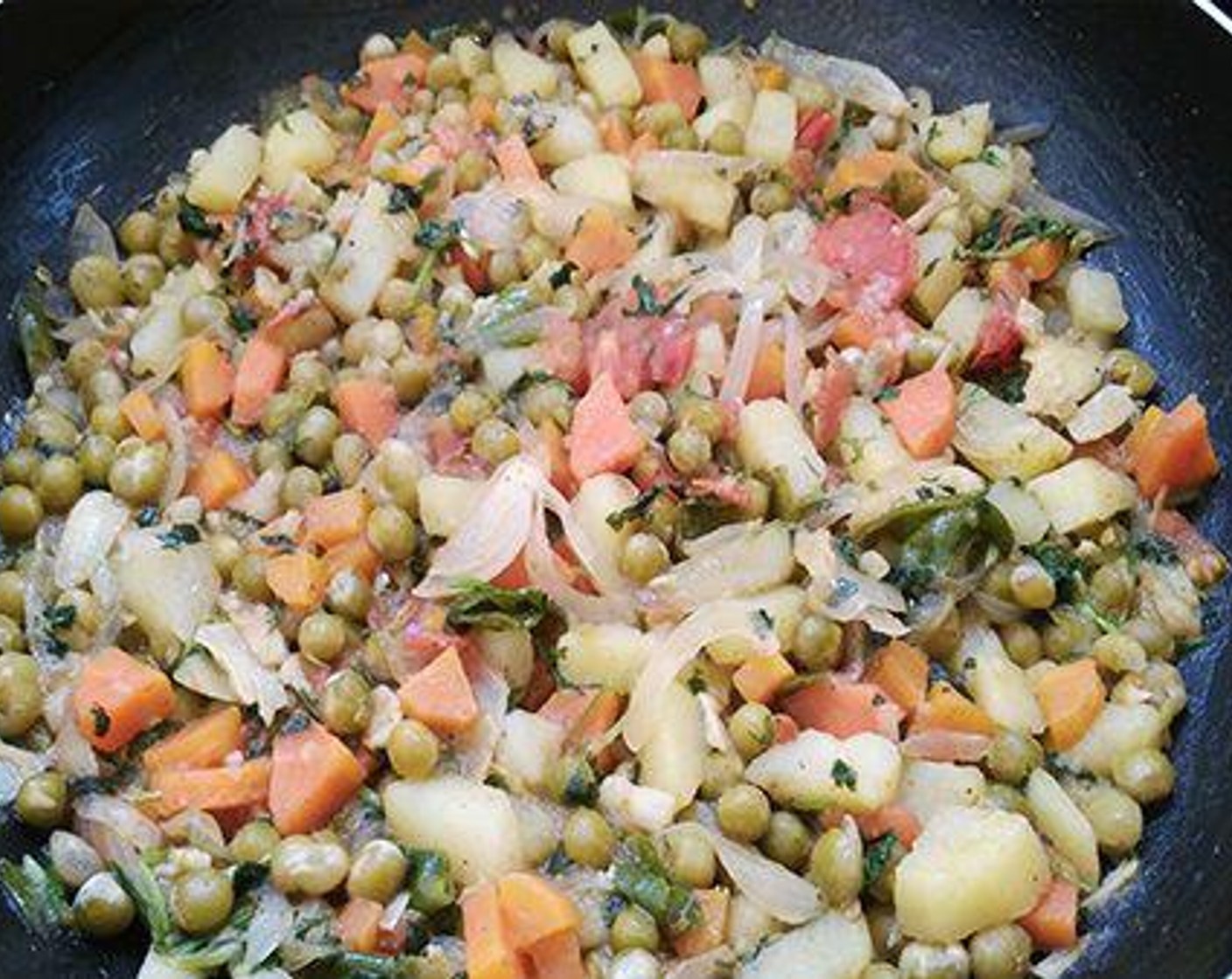 step 5 Saute till the onion becomes soft and add chopped Tomato (1) and cook for four to five minutes. Now add chopped Potato (1), Carrot (1), Green Peas (1/2 cup), 1 tablespoon of fresh mint, 1 tablespoon of coriander leaves, Salt (to taste), and Garam Masala (1/4 tsp). Add little water and cover and cook. Once done switch off the flame and keep aside.