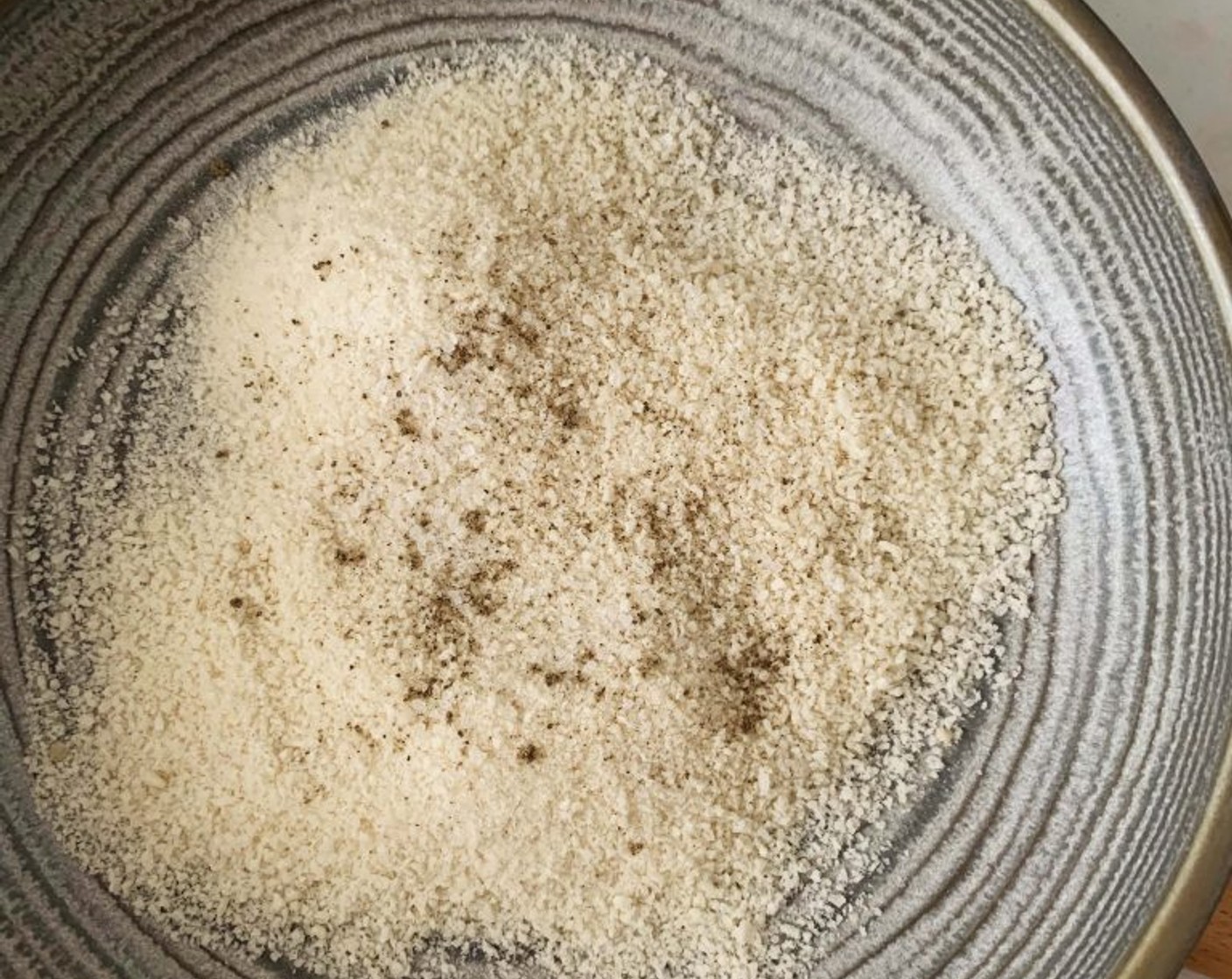 step 2 Next, in a shallow bowl, stir together Breadcrumbs (as needed), Salt (to taste), and Ground Black Pepper (to taste).