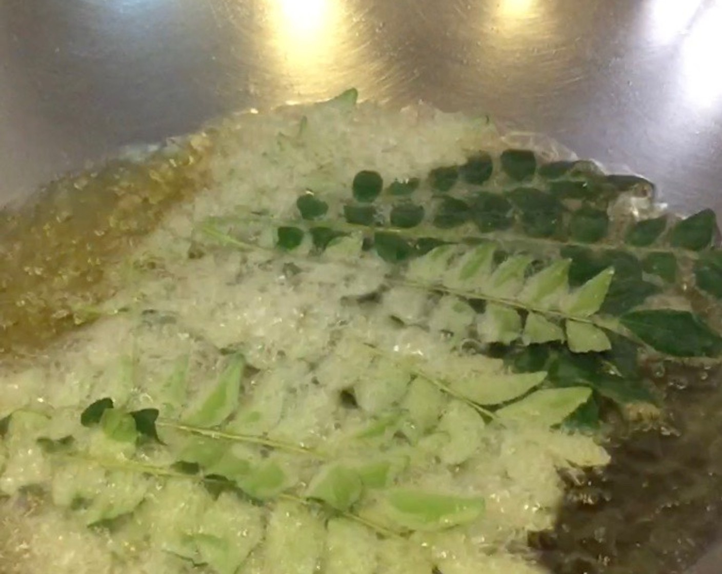 step 14 Then, fry some fresh Curry Leaf (1 bunch) in the oil. Drain out the fried curry leaves once the flavour has been released into the oil, about 3 minutes.