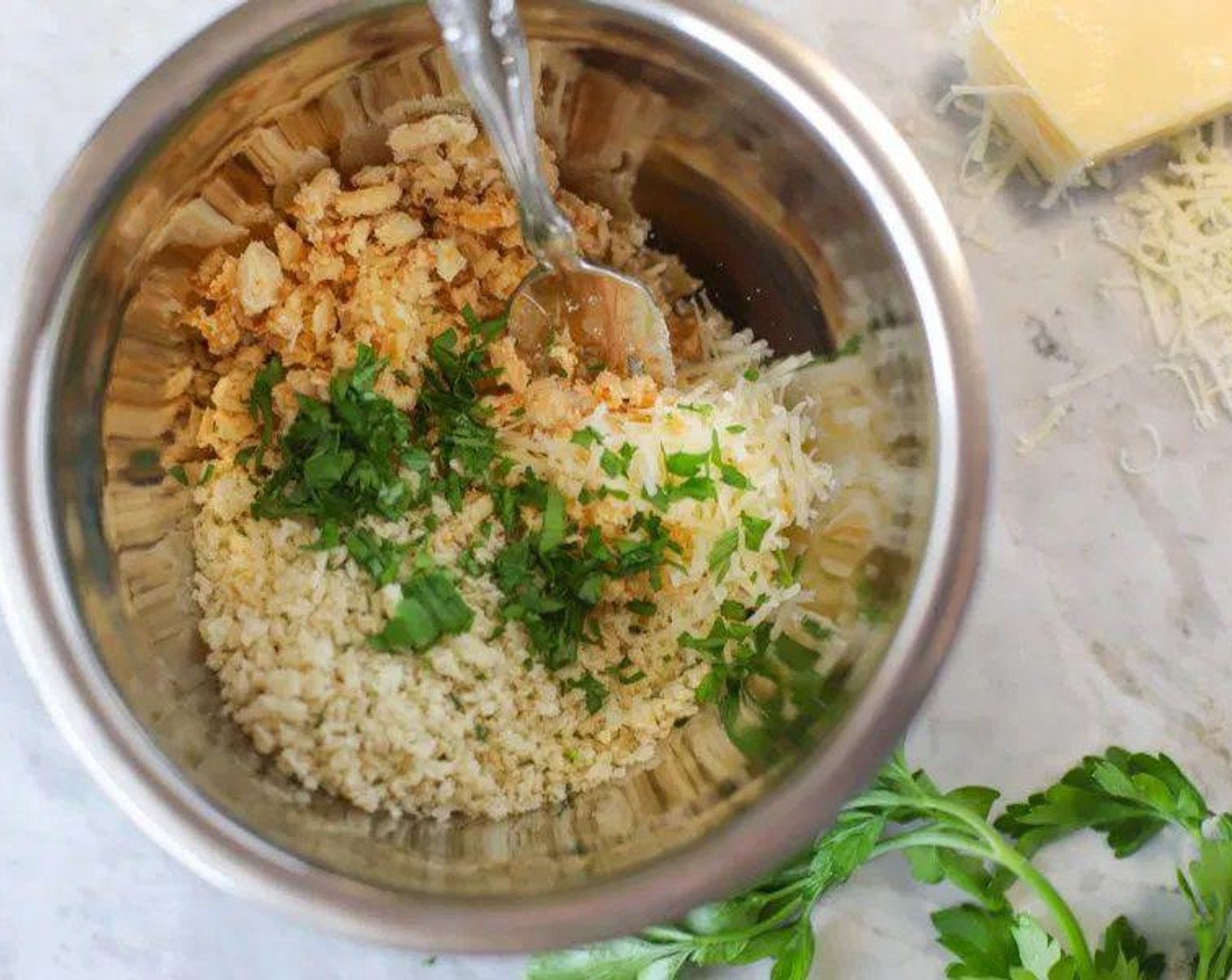 step 3 Meanwhile, prepare the crust topping. In a small bowl, measure out Fried Onions (2/3 cup) and crush into fine pieces with a fork. Add Seasoned Panko Breadcrumbs (2/3 cup), Parmesan Cheese (1/4 cup), and Fresh Parsley (1 tsp) to bowl and mix until combined. Set aside.