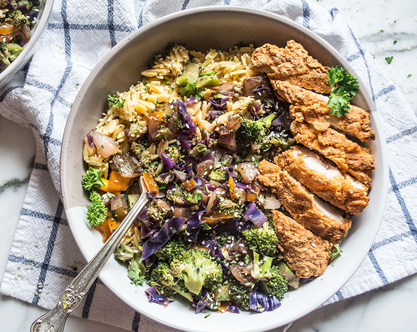 step 5 Divide chickpea rice among 4 bowls, top with cooked veggies and Tofu (to taste) or any protein of your choice, garnish with Sesame Seeds (to taste) and Fresh Parsley (to taste). Enjoy!