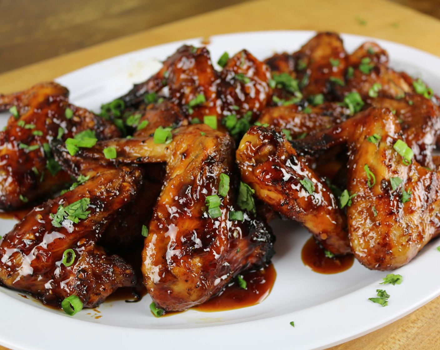 step 11 Serve the wings with a drizzle of extra sauce and Fresh Cilantro (1 Tbsp) and Scallion (1 Tbsp) and enjoy!