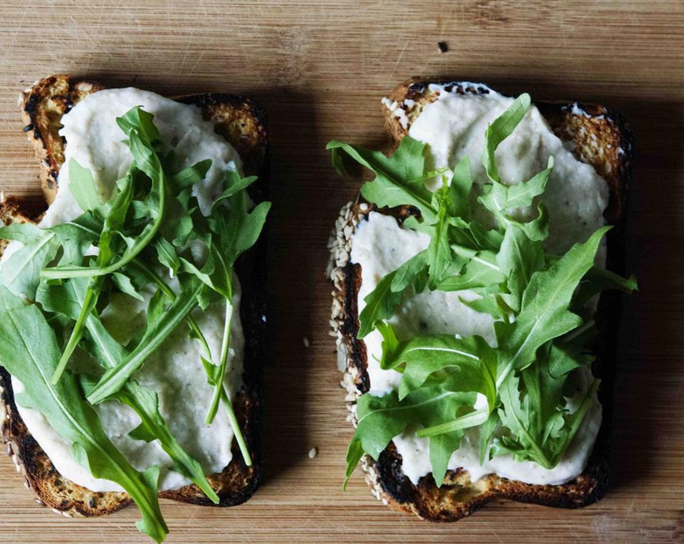 step 6 Spread if evenly then add some fresh Arugula (1 handful).