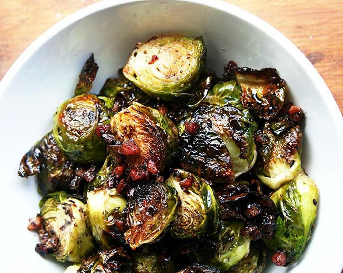 step 5 Remove pan from the oven, drizzle immediately with the balsamic vinegar and toss again. Taste and adjust the seasoning with salt and pepper. Serve hot.