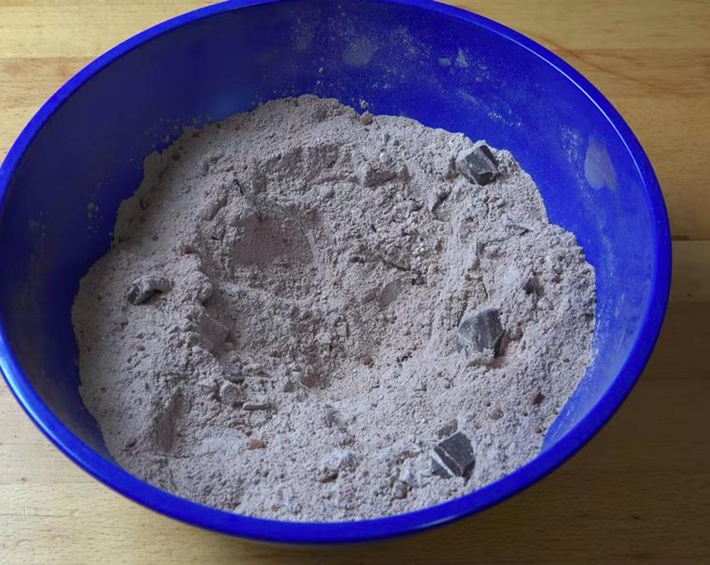 step 1 In a mixing bowl, add Self-Rising Flour (1 1/2 cups), Caster Sugar (1 cup), Unsweetened Cocoa Powder (1/2 cup), and Semi-Sweet Dark Chocolate (1/2 cup). Mix until combined.