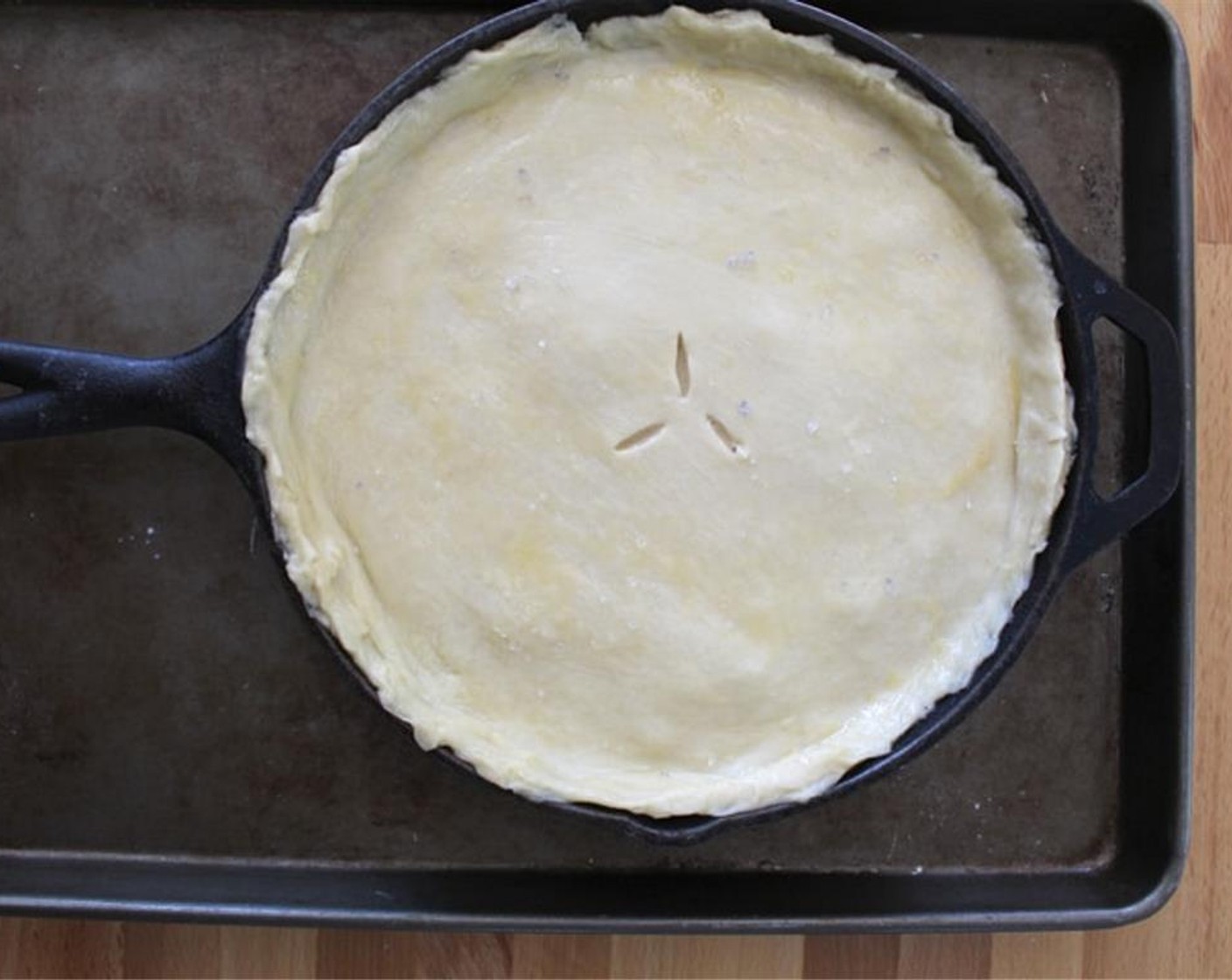step 10 Top the filling with the crust. Be careful, the skillet is hot! Make a few air vents with a sharp knife.